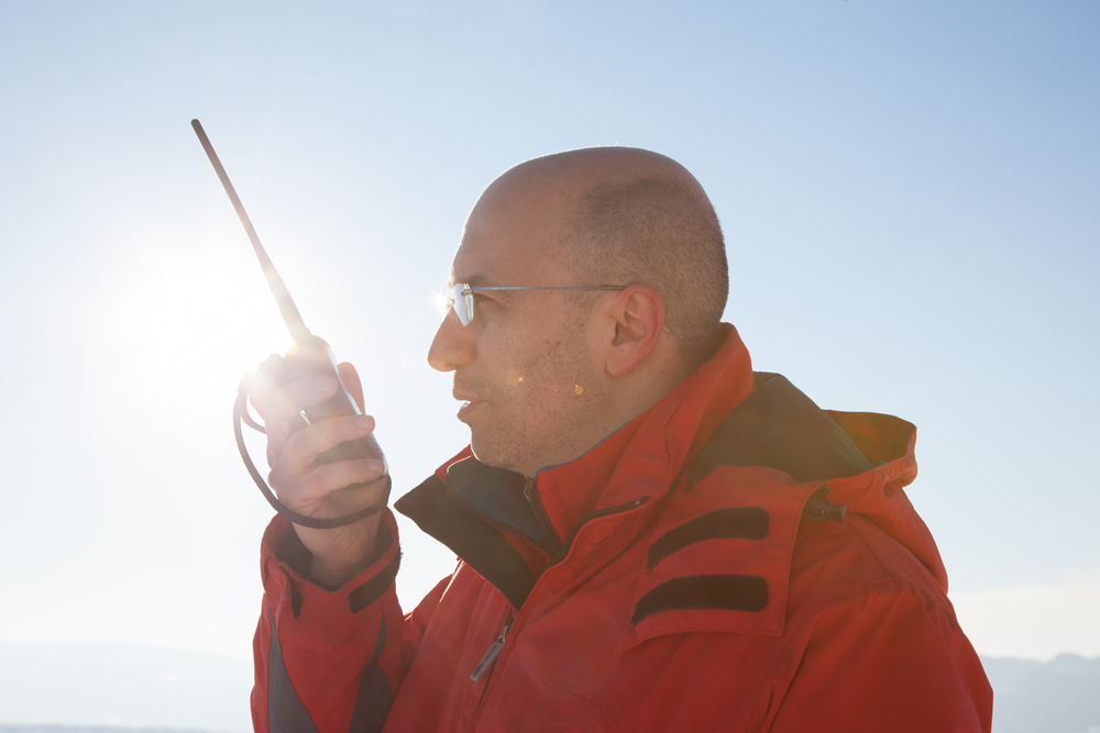 How does a PTT satellite phone work?